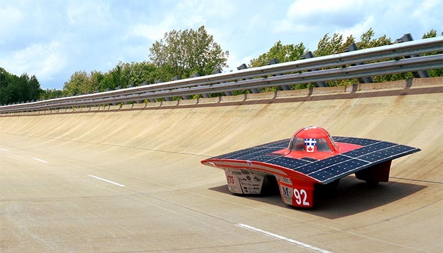 Solar-powered vehicle designed by engineering students demonstrates innovation and sustainable technology.