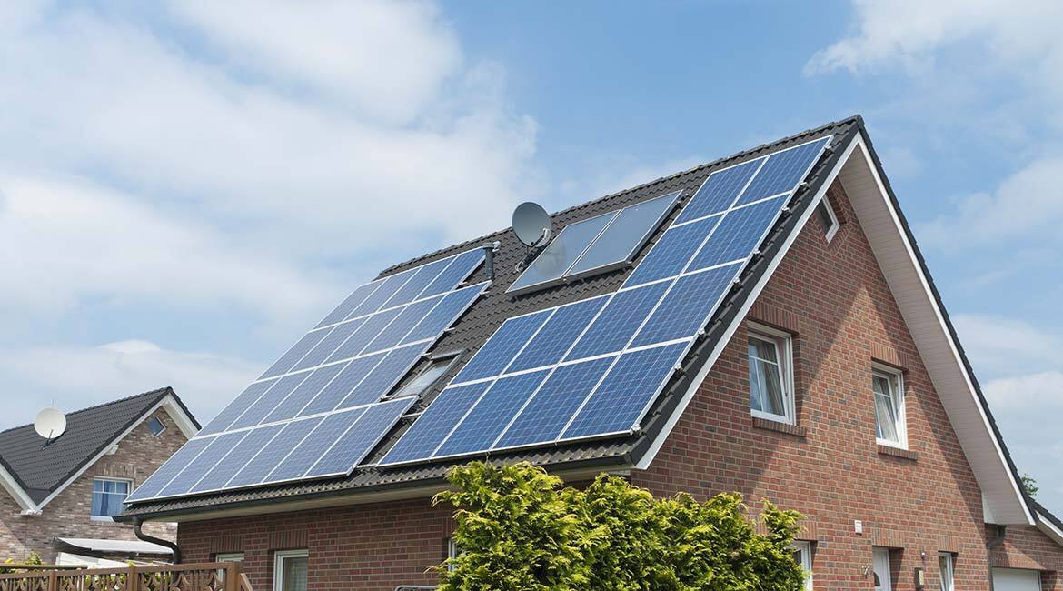 Photovoltaic solar collectors on the roof of a house