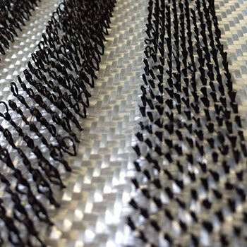 Advanced carbon fiber composite material with a unique woven pattern.