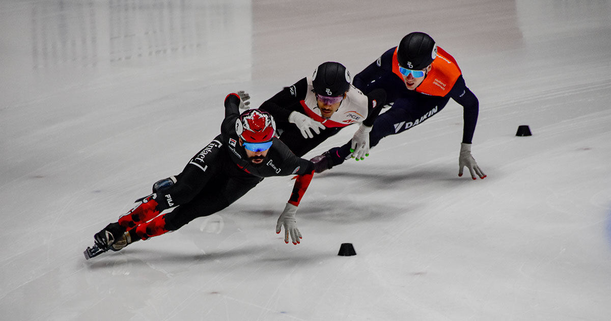 Speed skaters competing with focus and determination.